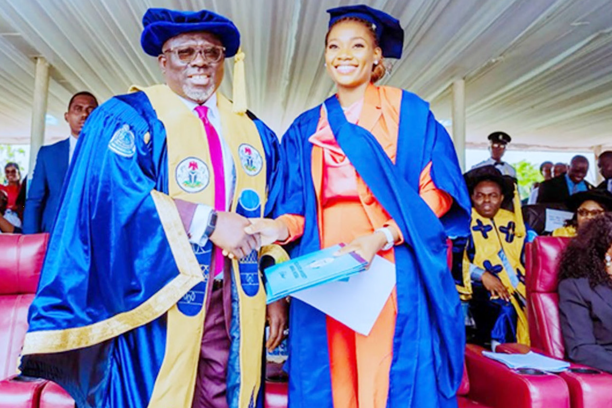 Gov Oborevwori with Ms Okwa Favour Oghenemine, the best graduating student of DeltaState University, Abraka.