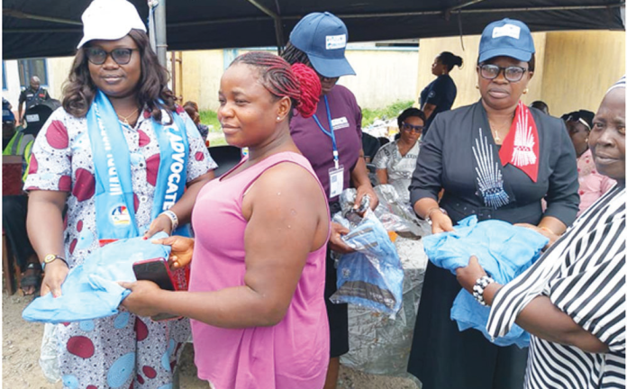 Warri North Local Government Council Chairman’s wife, Mrs Omasan Ashima (left), and Vice Chairman of the Council, Hon. Mrs Florence Bisina (2nd right), giving out free insecticide treated mosquito nets to beneficiaries at this year’s flag-off of the programme in Koko, head¬quarters of Warri North Local Government Council Area.