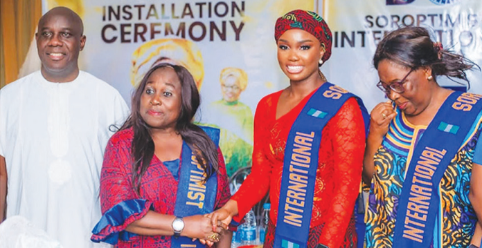 Delta State Commissioner for Humanitarian Affairs and Girl-Child Development, Orode Uduaghan (2nd right); in a handshake with the newly inducted 14th President of the Soroptimist International, BS Uche Onwumah (2nd left); the Chairman of the occasion, Rtn. Andy Uwejeyan (left) and the past president, Mrs Theresa Allana (right), held at the Lamsbertian Hotel, Asaba.