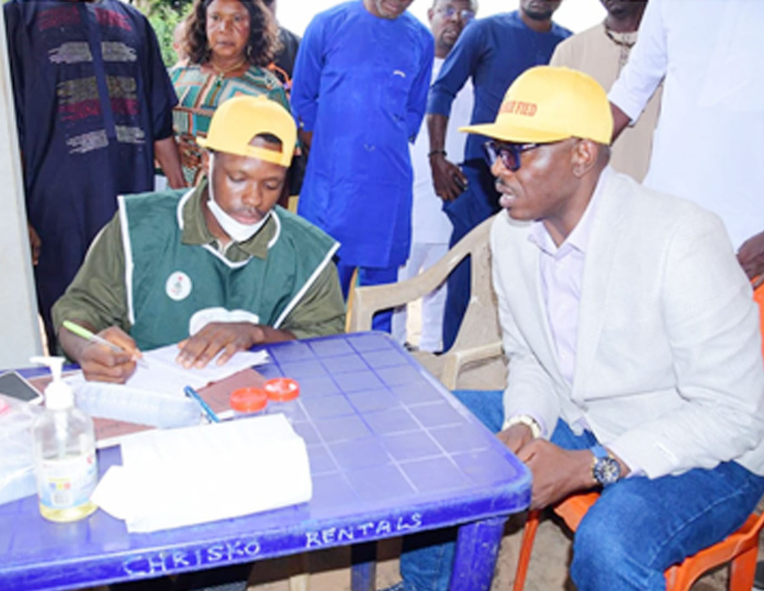 The Chairman , Oshimili North Local Government, Hon Innocent Esewezie (right) with a health official during the 14- day free health Care at the Primary Health Centre in Akwu-kwu Igbo, Delta State.