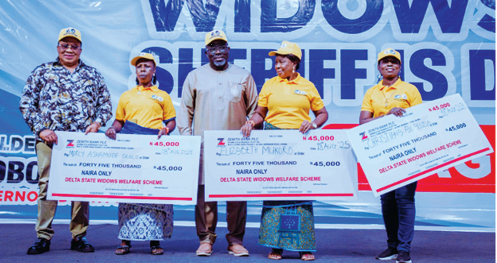 Delta State Governor, Rt. Hon. Sheriff Oborevwori (middle); Executive Assistant to the Governor on Social Investment Programme/State Coordinator Delta State Widows Welfare Scheme, Elder Isioma Okonta (left), with some of the beneficiaries of the Delta State Widows’ Welfare Scheme (Widows Alert) after being presented with their dummy cheques in Asaba, yesterday.
