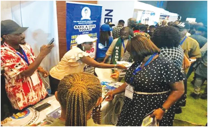 DSCHC officials attending to business operators, during the maiden MSME Summit held in Asaba.