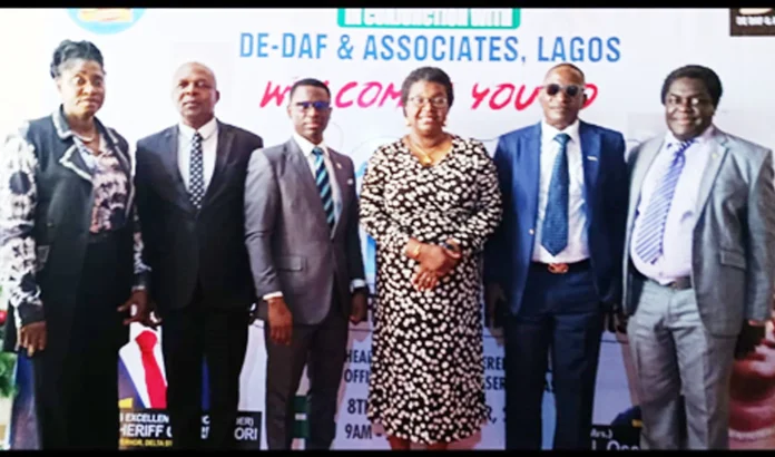 Delta State Head of Service Dr. Mrs Mininim Oseji (3rd right); the Functioning Permanent Secretary, Directorate of Establishment and Pension,Mr. Kingsley Olomukoro (right), and others at the retirement seminar for civil servants in Asaba, yesterday. PIX: PATRICK MGBODO